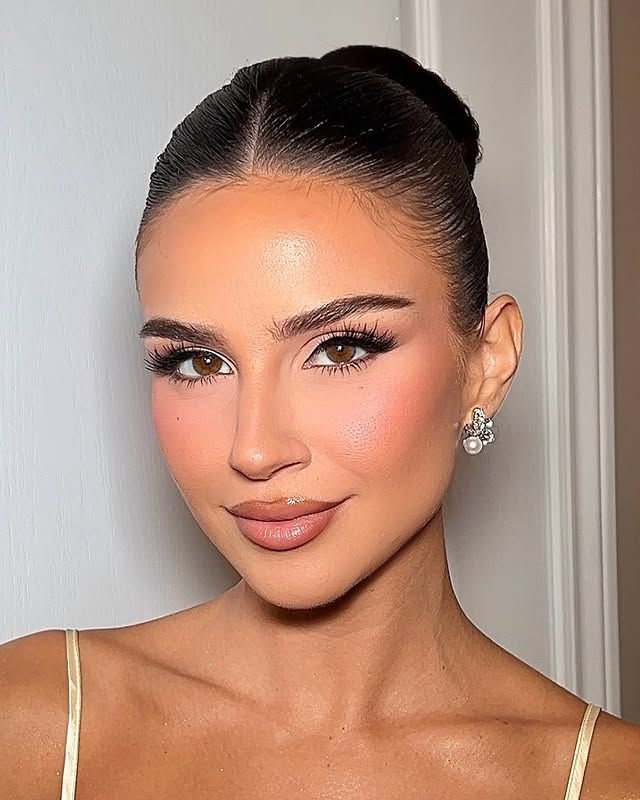 Slicked back bun updo with middle part. Middle-part-slicked-back-bun-updo