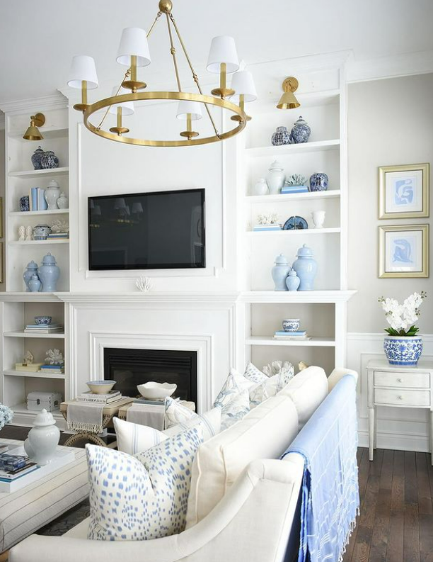 blue and white ginger jars on living room open shelves