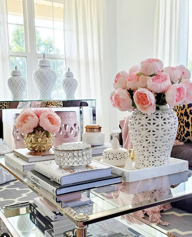 white ginger jars on glass coffee table. ginger jar decor tips