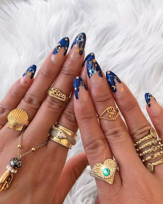 Blue and gold evil eye birthday nails.