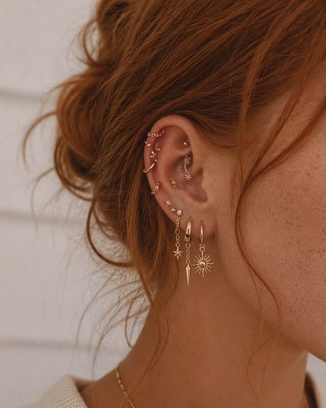 Yellow gold celestial earring stack jewelry. Yellow gold celestial earring stack jewelry.
