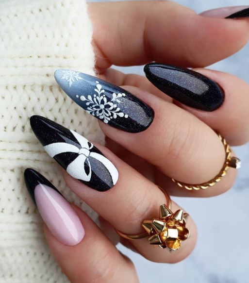 black snowflake bow christmas nail designs. winter nail design ideas.