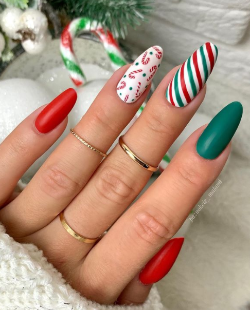 red white and green candy cane christmas nail art. winter nail design ideas