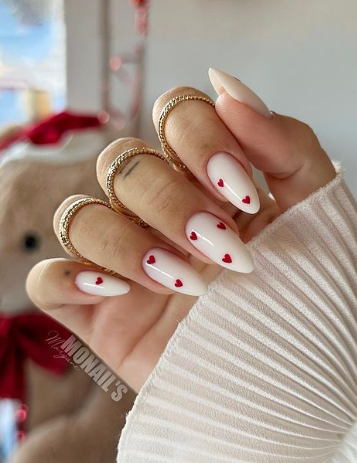 nude nails with red hearts. heart nails. valentines nails ideas. february nails.