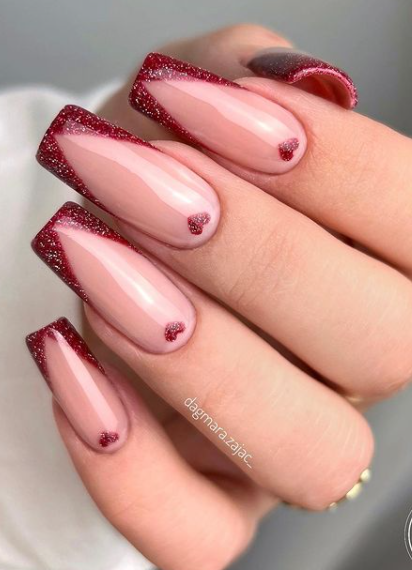 red shimmer french tip heart valentines day nail design