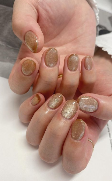 beige classic nude nails. shimmer nude nail ideas. warm neutral nails manicure.