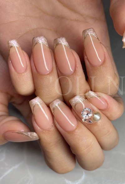 gold tipped nude nails. wedding nails nude. soft pink nails coffin shape acrylic