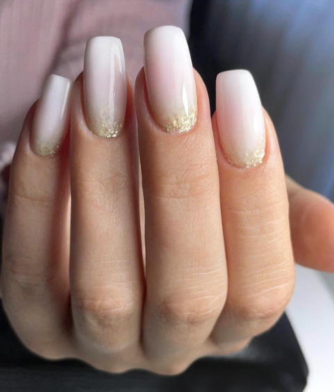 light pink nude nails with gold glitter cuticles. wedding nails nude. simple coffin nails acrylic.