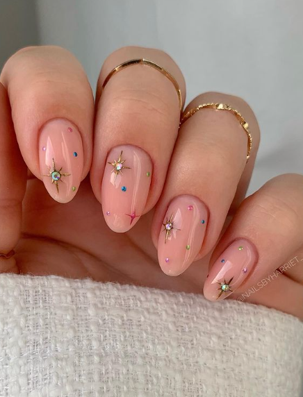 nude pink nails with stars and crystals. nude wedding nails. bridal nails.