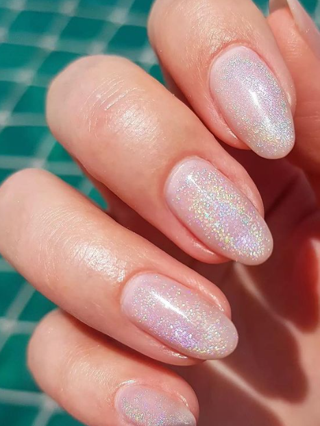 soft pink glitter shimmer nude nails. nude nails simple ideas. nude nails trends acrylic.