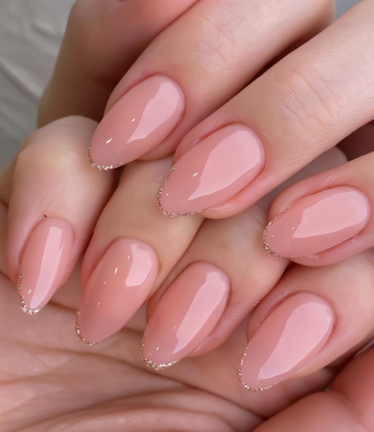 soft pink nude nails with gold tips. nude nail ideas wedding nails. acrylic nude nail design