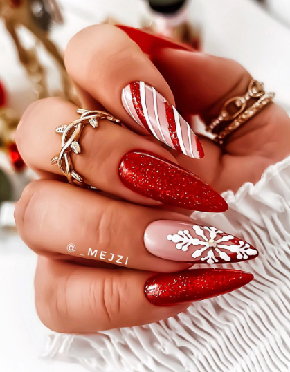red and pink candy cane festive nails. december nails. winter holiday nails. christmas nail ideas.