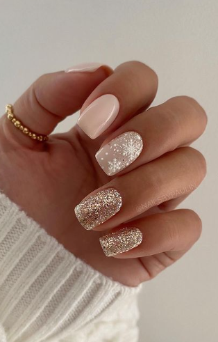 simple nude neutral winter nails. snowflake nail designs. gold glitter and pink christmas nails. festive holiday nails winter short.