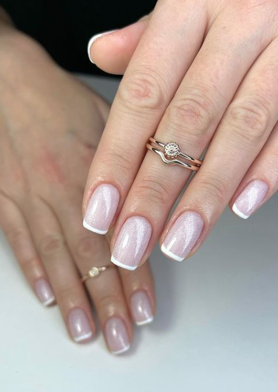 french manicure shimmer pink nails. tipped wedding nails. bridal nail ideas. trendy minimal nude nails.