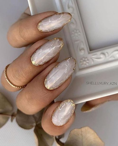 marble gold tipped nude nails. wedding nail ideas. bridal nails. trendy nail ideas almond.