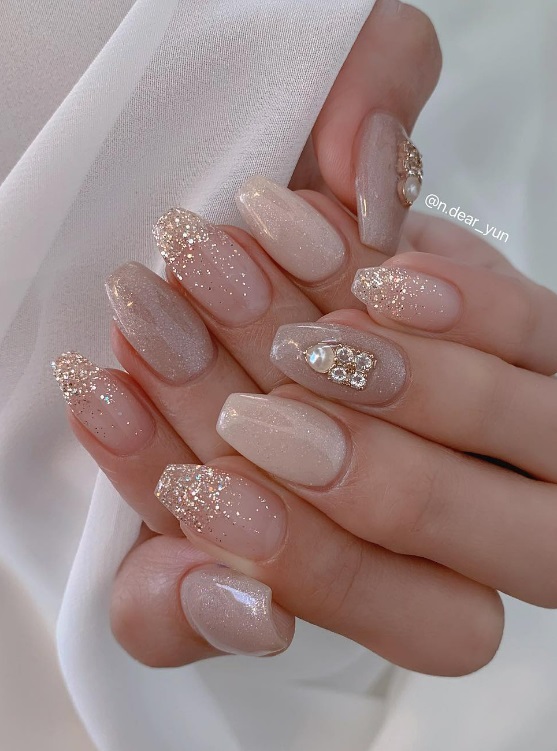 nude neutral wedding nails with pearls and crystals. warm neutral bridal nails coffin acrylic.