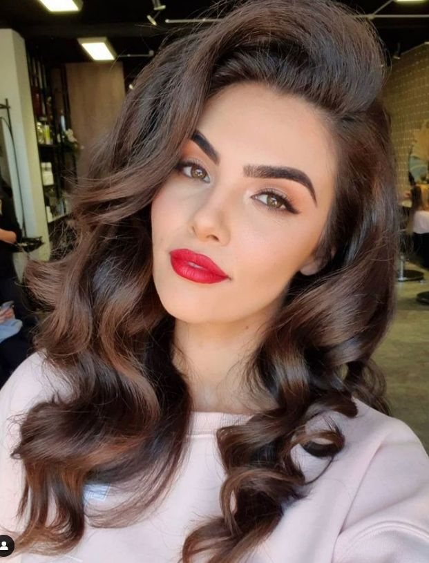 vintage makeup look with red lips. brunette hair color for fall.