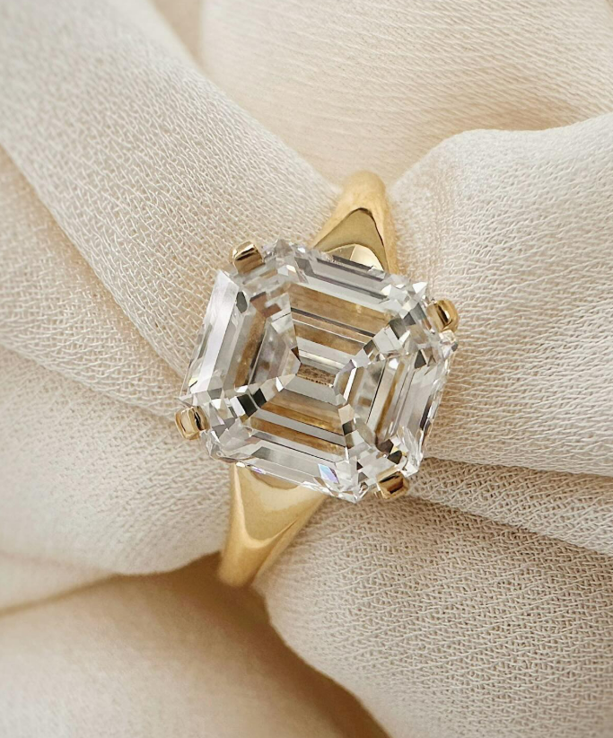 Solitaire emerald cut yellow gold engagement ring Solitaire emerald cut yellow gold engagement ring