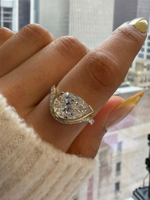 Pear cut diamond east west engagement ring.