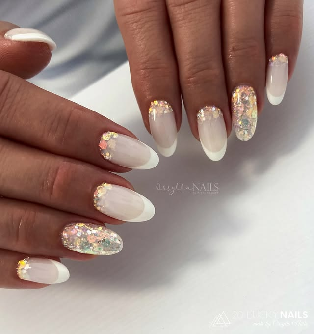 Soft white French bridal nails with glitter. glitter-white-bridal-nails
