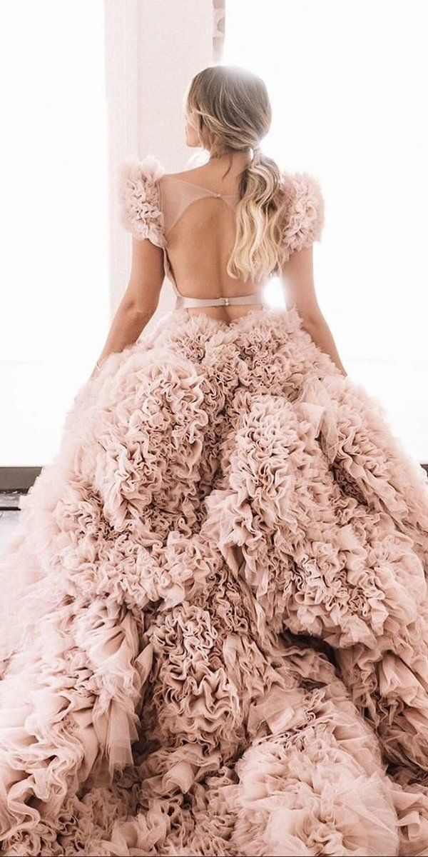 Blush pink colored wedding dress in tulle. Blush pink colored wedding dress in tulle.