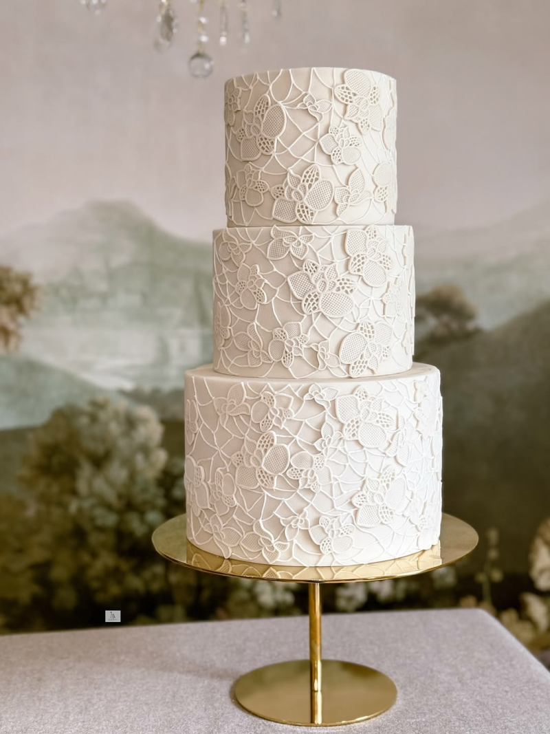 Wedding cake with lace pattern details Wedding cake with lace pattern details