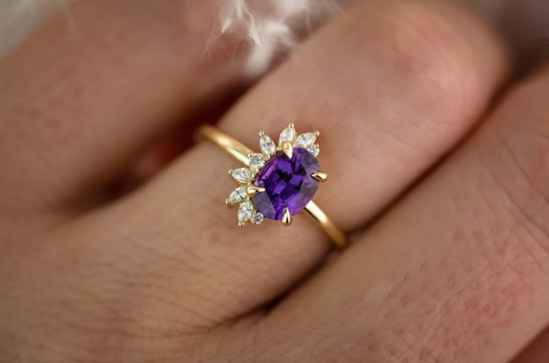 Purple oval cut sapphire colored unique engagement ring. Purple oval cut sapphire colored unique engagement ring.