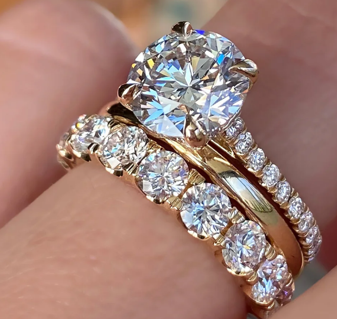 Round diamond eternity ring and gold band wedding stack