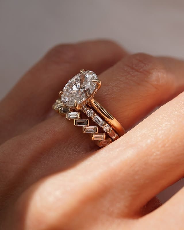 Unique wedding band stack, oval engagement ring.