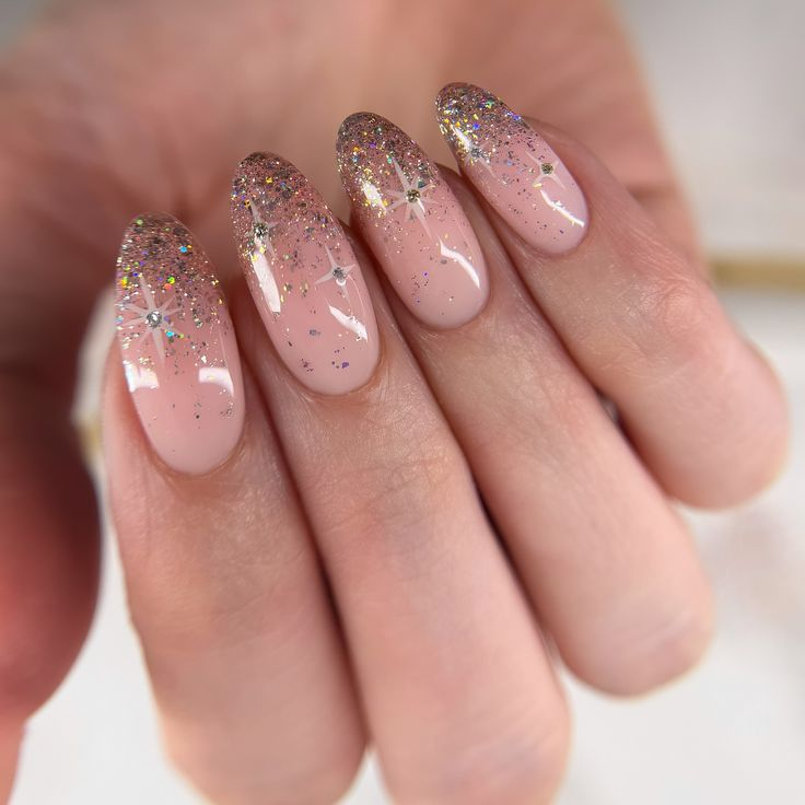 Nude pink new years eve nails with glitter tips