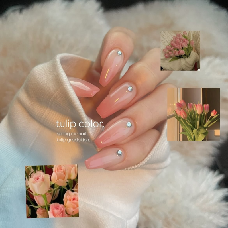 Peachy nude acrylic bridal nails with crystals.