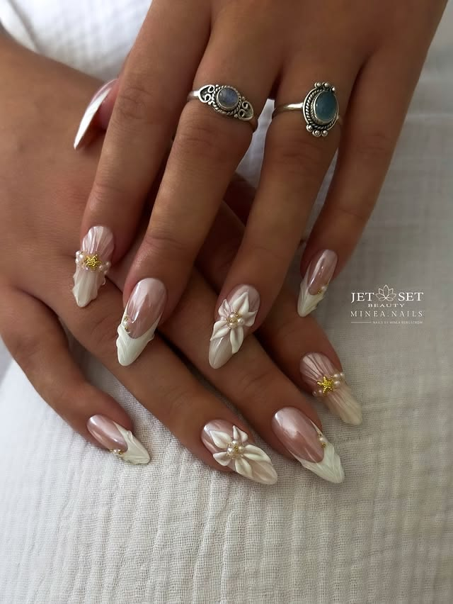 French acrylic almond nails with 3d flowers.