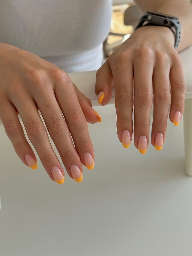 Yellow French tipped nails for summer.