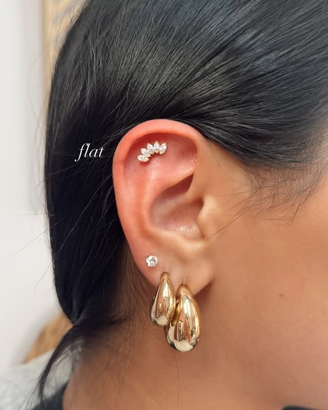 Large gold hoops with flat ear piercing Large gold hoops with flat ear piercing