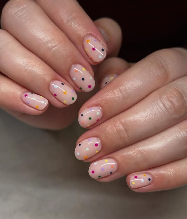 Nude nails with colored polka dots - birthday nails.