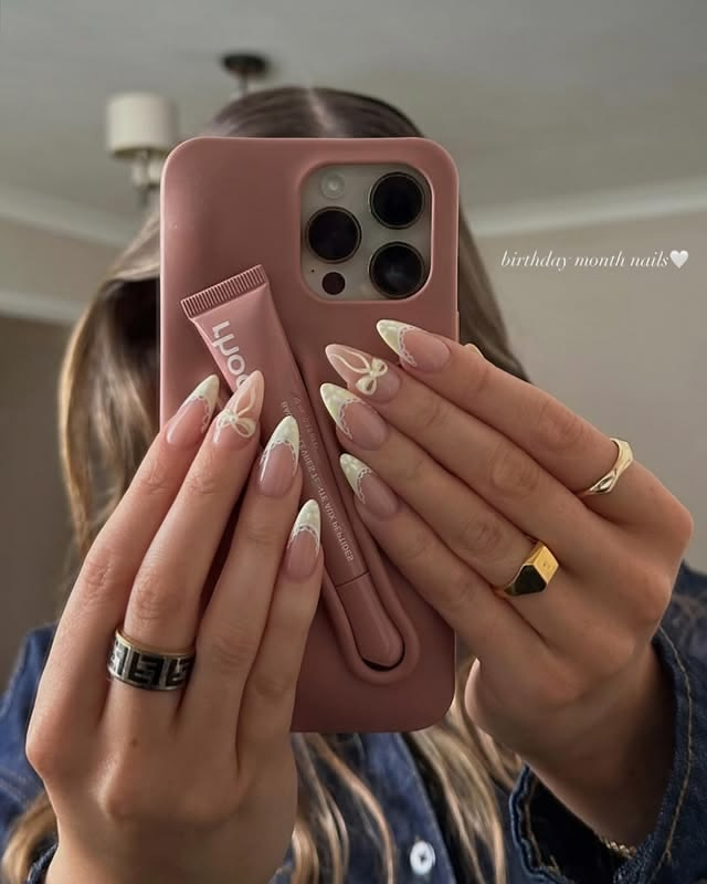 Birthday nails with bow details.