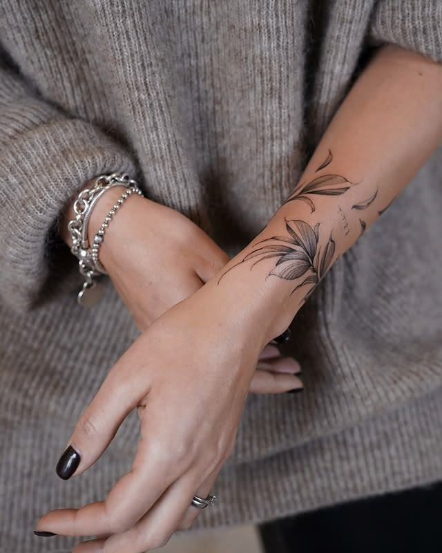 Delicate leafy wrist wrap tattoo ideas for women.