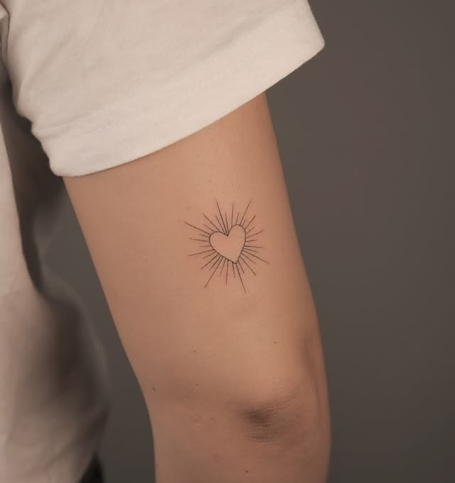 Fine line heart tattoo.