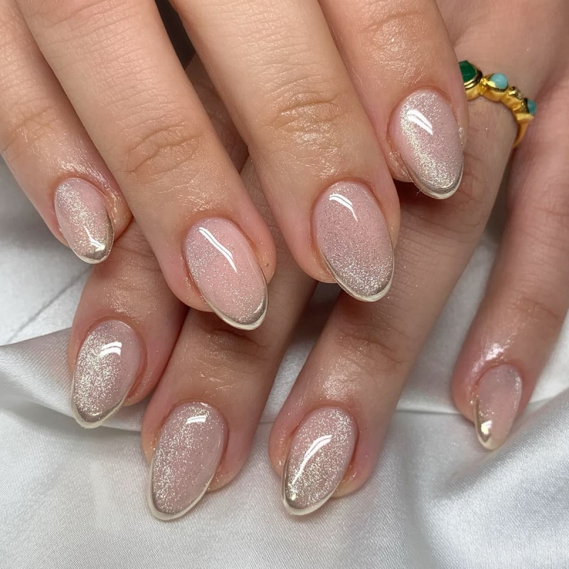 Gold glittery birthday nails.