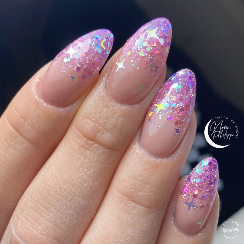 Purple glitter-tipped birthday nails.