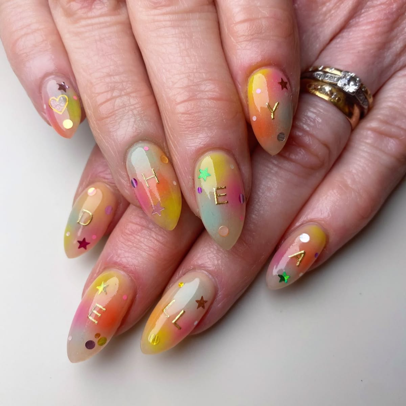 Rainbow glass birthday nails.