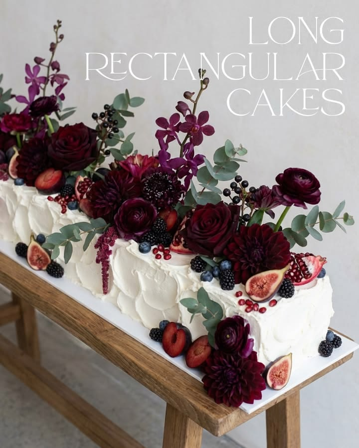 Rectangular wedding cake with florals and fruit in fall wedding colors. Rectangular wedding cake with florals and fruit in fall wedding colors.
