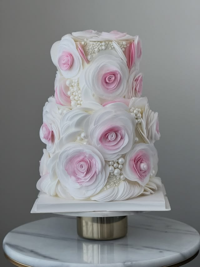 Rose-covered wedding cake. Rose-covered wedding cake.