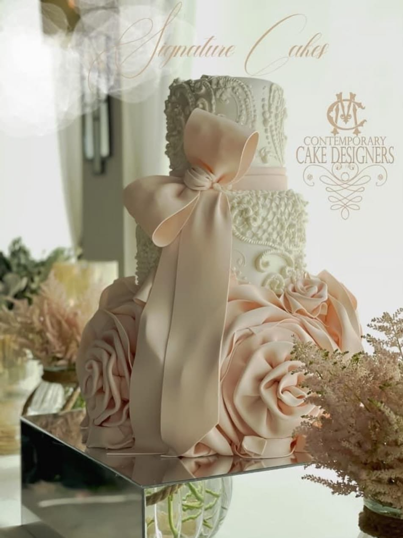 Wedding cake with bow details. Wedding cake with bow details.