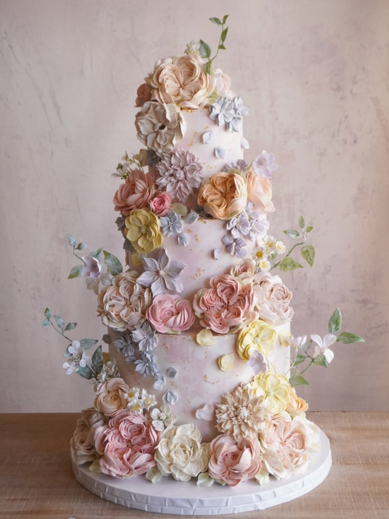 Wedding cake topped with hand-piped flowers Wedding cake topped with hand-piped flowers