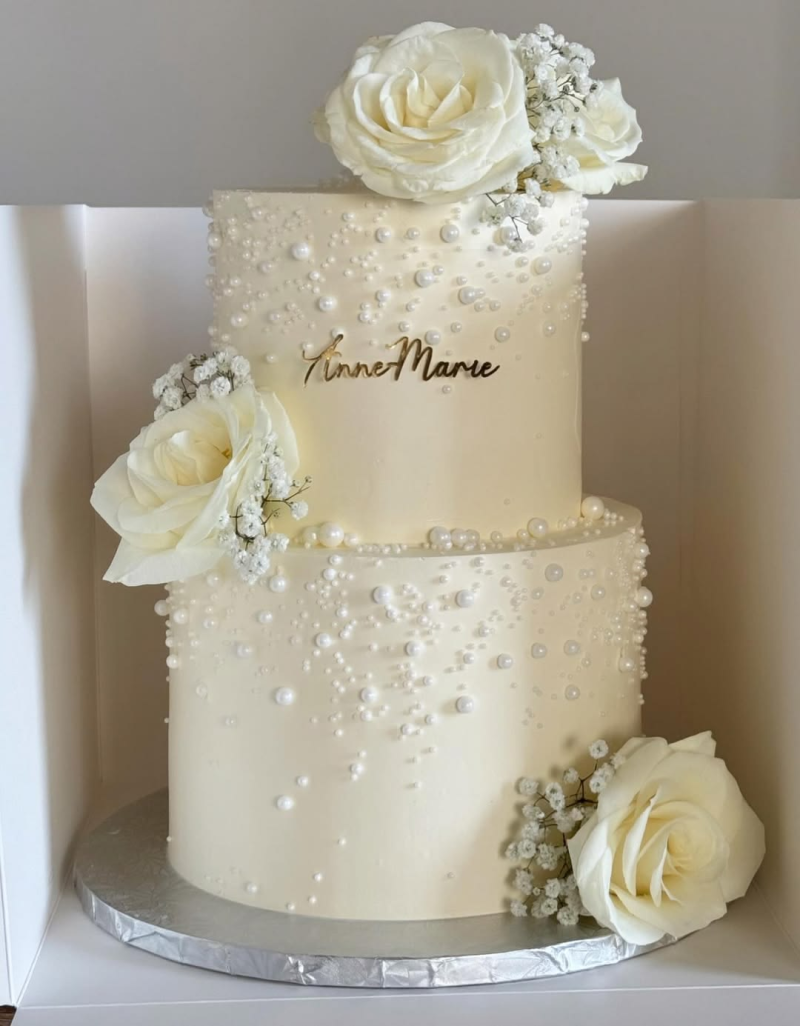 Wedding cake with flower and pearl details. Wedding cake with flower and pearl details.
