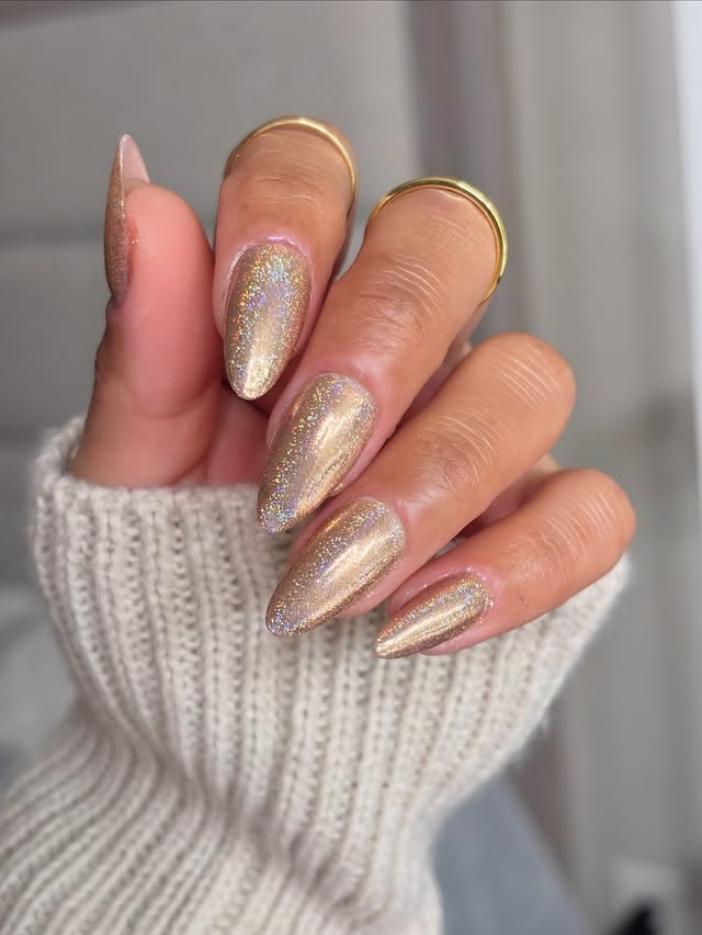 Almond shaped gold glitter nails for parties and special occasions to make you shine!