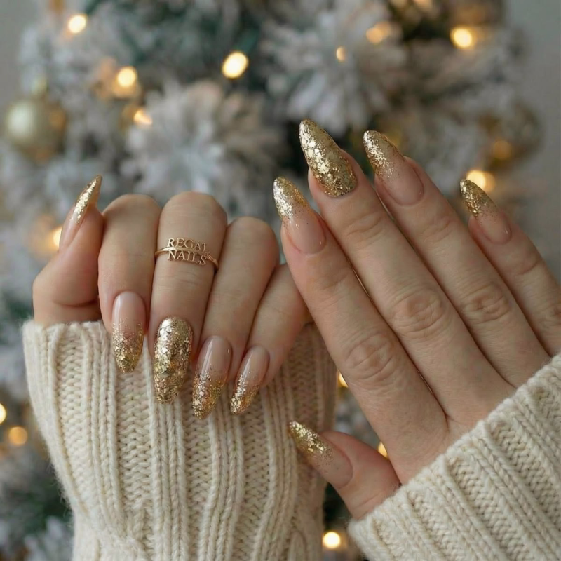 Chunky gold glitter festive nails for Christmas or winter holiday parties.