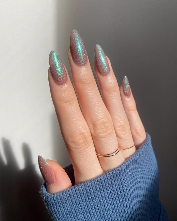 Iridescent celestial glitter nails in almond shape